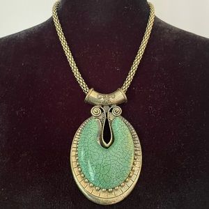 Antique style amulet statement necklace with turquoise coloured stone